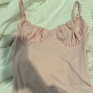 Baby pink body suit